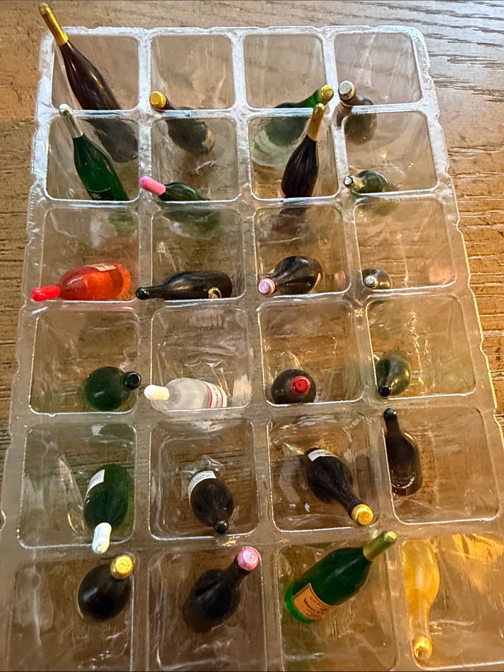 48 tiny plastic champagne bottle decorations